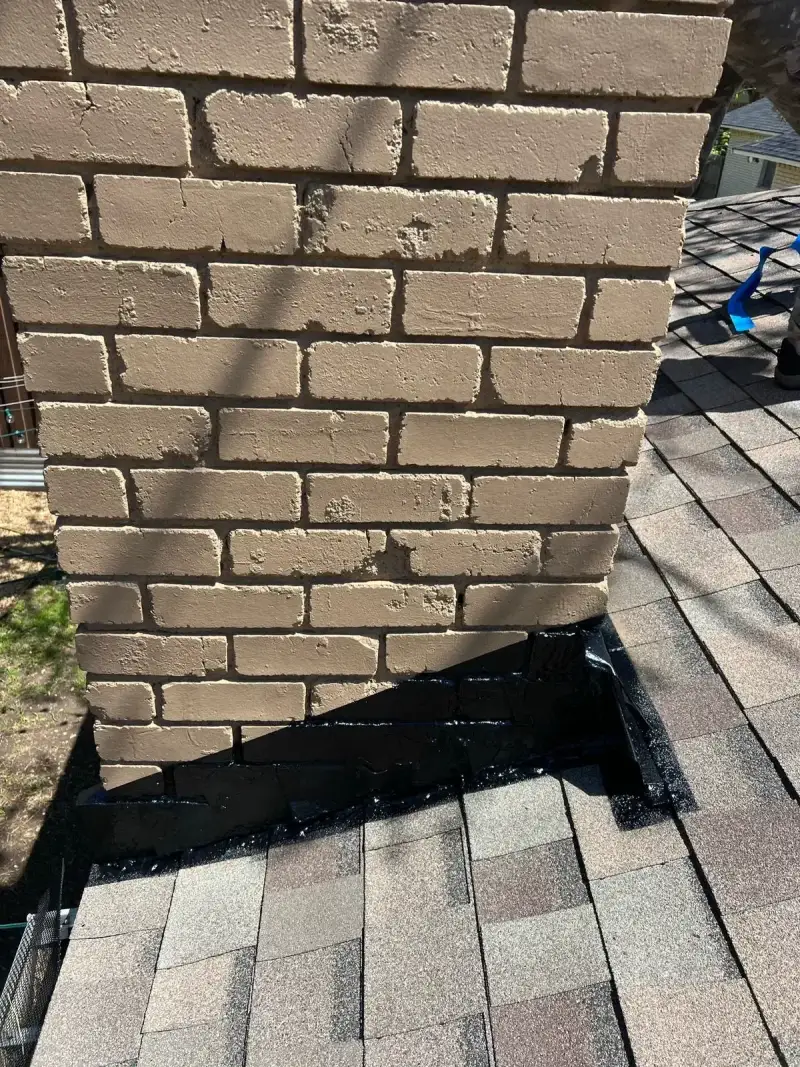 Professional chimney sweep in progress - removing creosote and soot buildup from Austin home fireplace