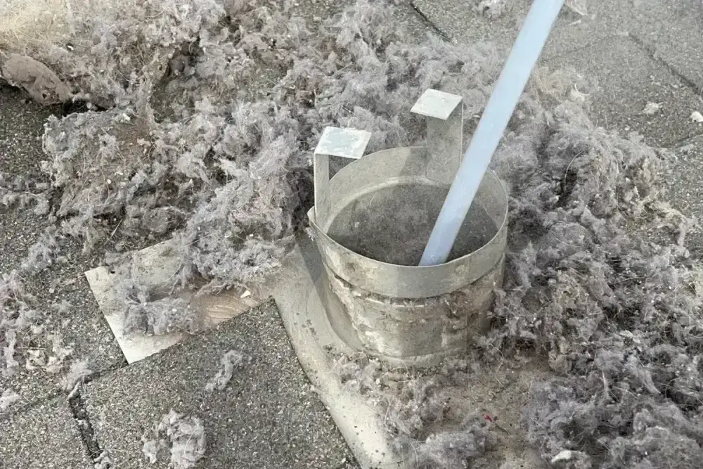 Sign 4: Lint on Clothes After the Drying Cycle - Air Central dryer vent service in Austin TX