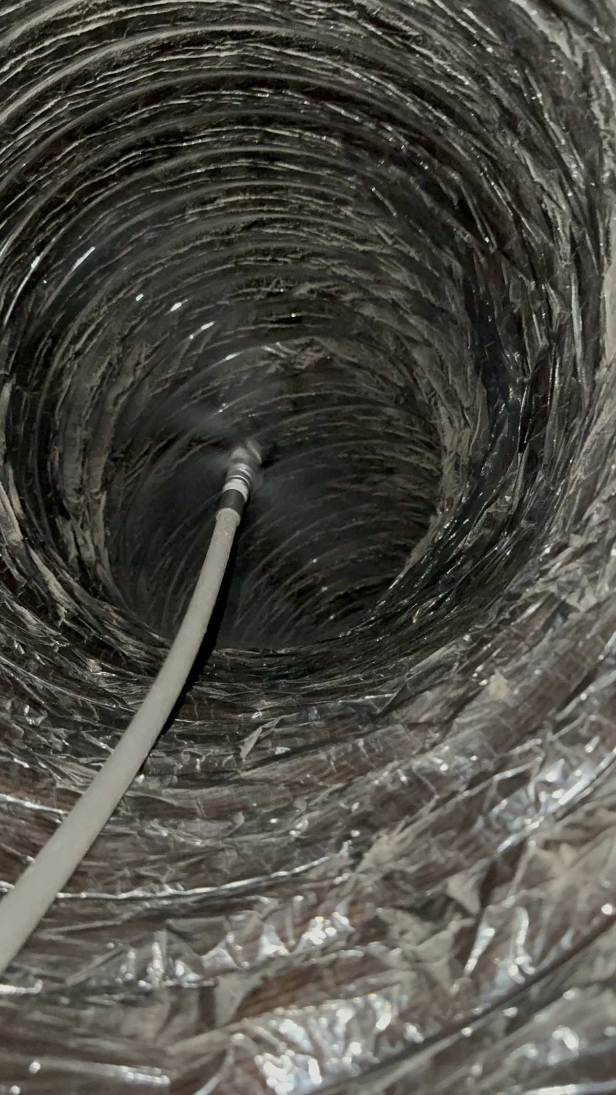 Air duct before cleaning showing heavy dust accumulation in Austin home